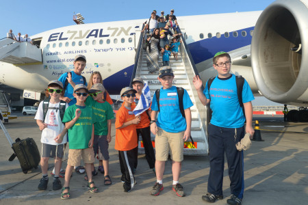 Children coming off the plane on arrival