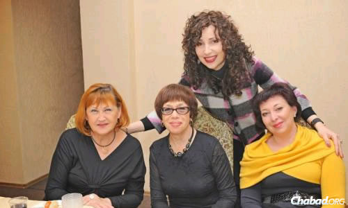 Chana Gopin (standing), with friends at a Chanukah activity in Lugansk.
