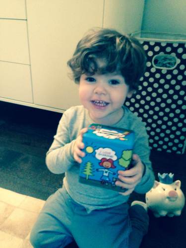 Landon Derikrava of Greenwich, CT enjoying his box. Photo courtesy PJ Library.