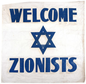 ZIONIST FLAG, 1942. "Welcome Zionists." English-language flag used at an international Zionist meeting at the Biltmore Hotel in New York City, May 6-11, 1942.