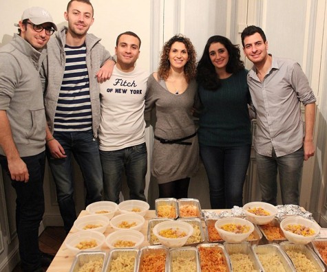 Moishe House Paris residents prepare food for their Tikkun Olam program.