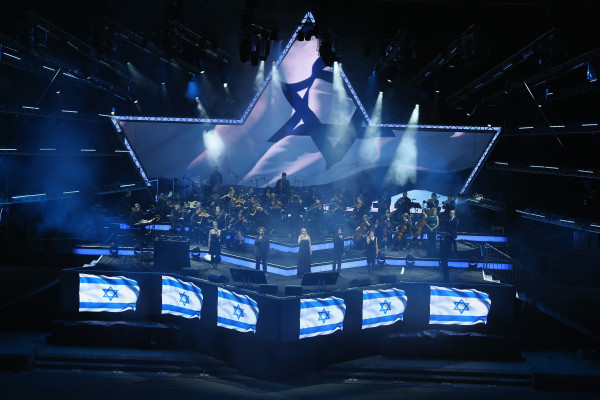 Singers perform the Israeli national anthem at the official opening ceremony of the European Maccabi Games at the Waldbuehne on July 28, 2015 in Berlin, Germany. Over 2,000 Jewish athletes from Maccabi clubs all over the world will compete for the next week in Berlin at the Olympiastadion where in 1936 Nazi Germany held the Olympics and excluded its own Jewish athletes. The Maccabi games take place every four years and first took place in Prague in 1929.