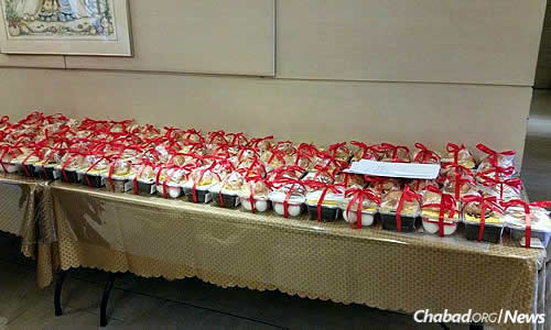 The finished food baskets, wrapped and ready for delivery. Photo courtesy Chabad.org/News.