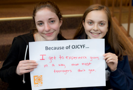 Abby M. (l) and Georgia G., Portland, Ore.-area high schoolers and first-year members of the Oregon Jewish Community Youth Foundation (OJCYF), share one of many positive feelings that stem from being teen philanthropists. Photo by Eden Swartz.