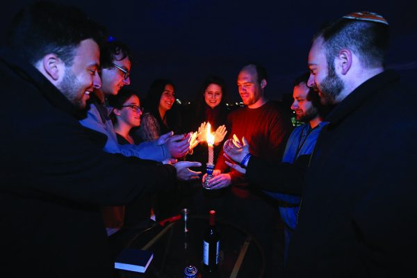 Moishe House Baltimore residents and community members come together for Havdalah on their rooftop. Photo courtesy Moishe House.