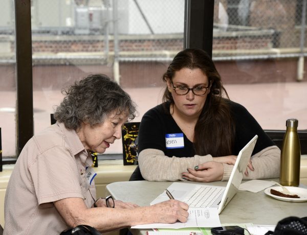(Wire the Wise): Sandra, a wise, learns from Keren, a wired, how to manage her cellular account at our event in Manhattan, New York City.