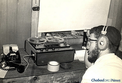 In January 1970, for the very first time, the Rebbe’s talk at the farbrengen after Shabbat was broadcast live through a phone-line hook-up to 1,000 Chassidim gathered in the village of Kfar Chabad, Israel. Inside the “World Lubavitch Communications Center” (WLCC), Meni Wolff can be seen working on the broadcast. (Photo: Mulik Rivkin Archive)