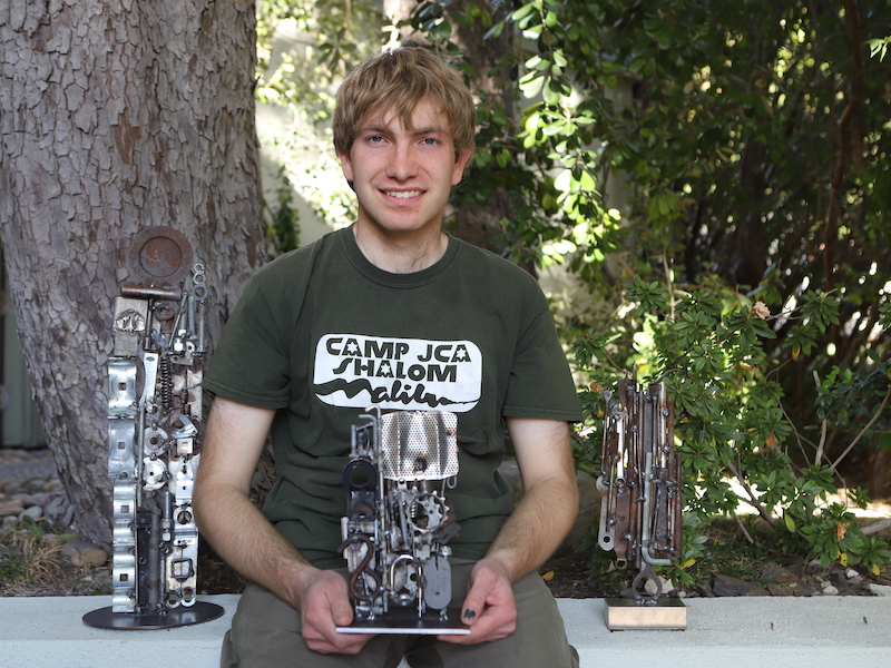 Ben Novak, 23, a metal sculpture artist, works at Shemesh Farms twice a week.