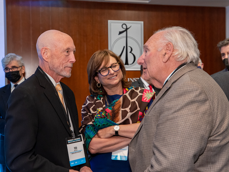 Ted Mitchell, president of the American Council on Education (left) speaks with participants at a meeting of college presidents to discuss combating campus antisemitism.