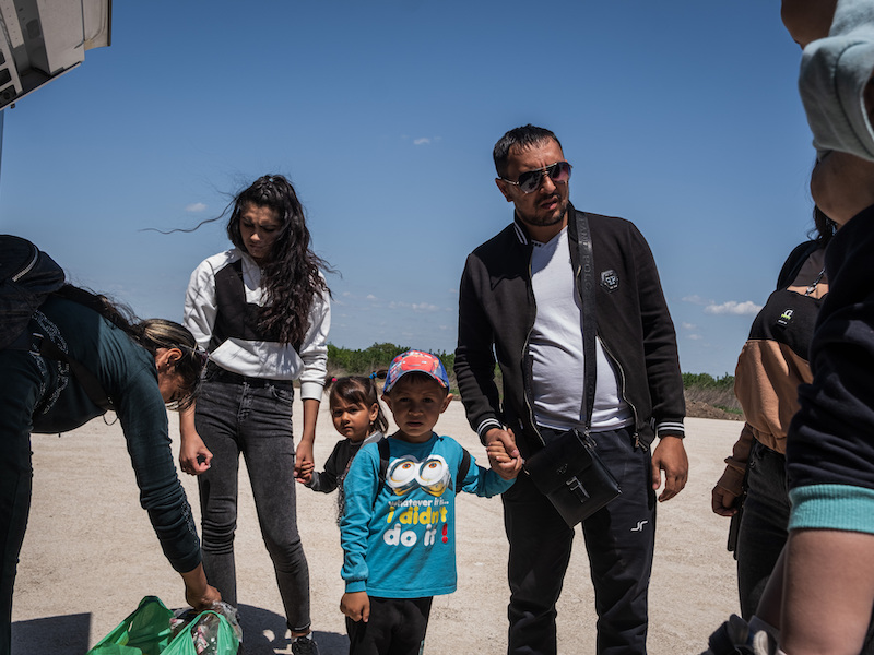 a family of ukrainian refugees boards a plane