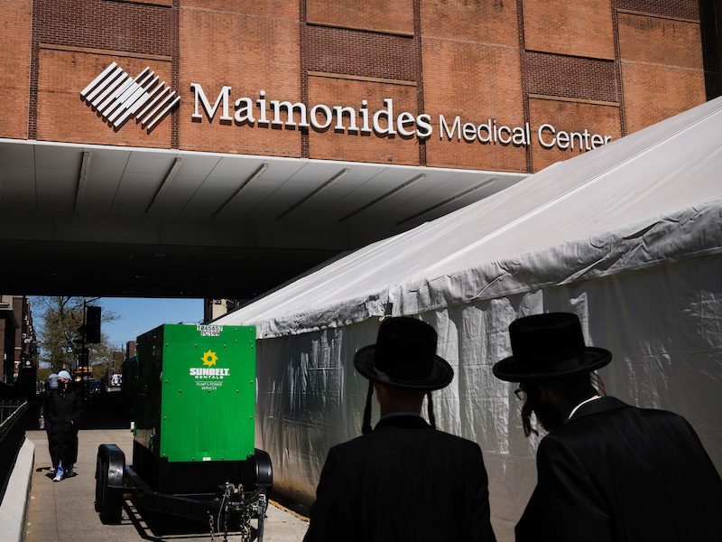 People walk into Maimonides Medical Center in April 2020, at the beginning of the pandemic.