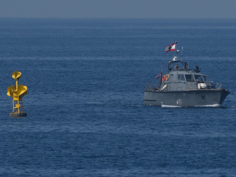 A Lebanese navy patrol boat next to a buoy marking the maritime border between Lebanon and Israel in the Mediterranean Sea on Oct. 27, 2022.