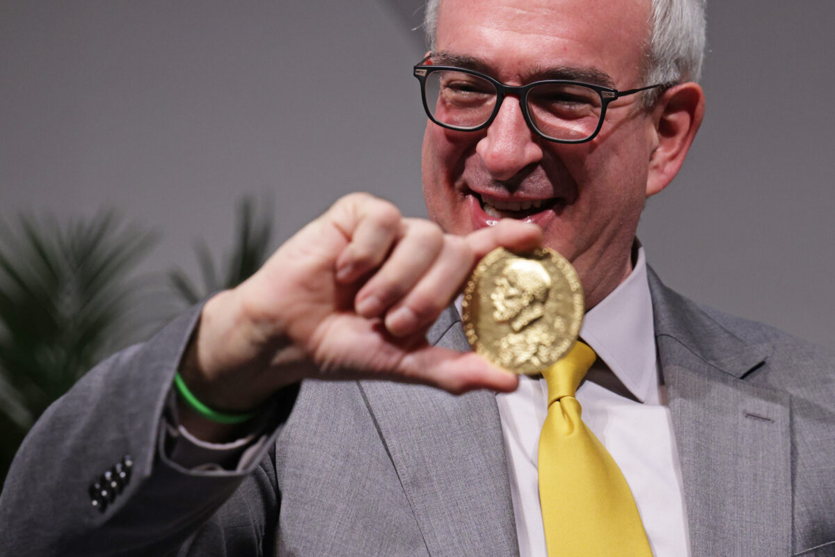 Economic sciences laureate Joshua Angrist poses for photos with his Nobel Prize medals during a ceremonial presentation of Nobel Prizes at U.S. National Academy of Sciences December 6, 2021 in Washington, DC.