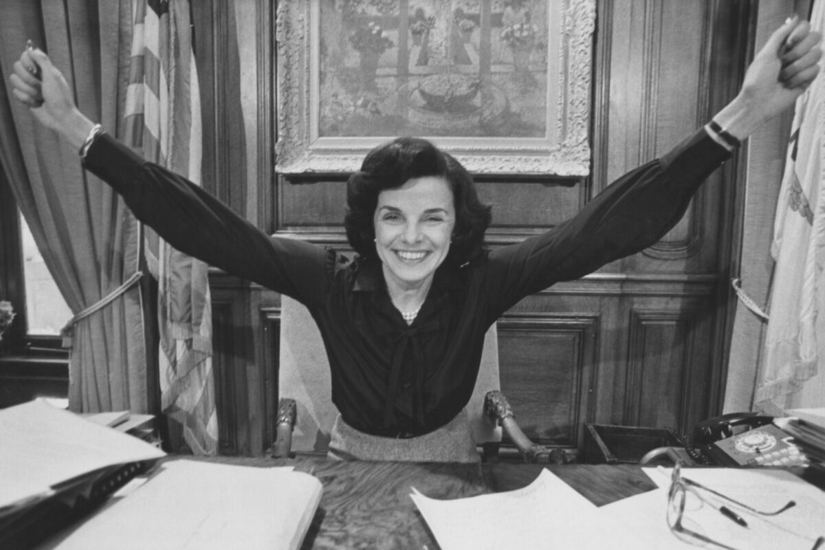 American politician Dianne Feinstein, her arms outstretched in celebration, in her office after she was elected mayor of San Francisco, at San Francisco City Hall in San Francisco, California, circa 1978. 