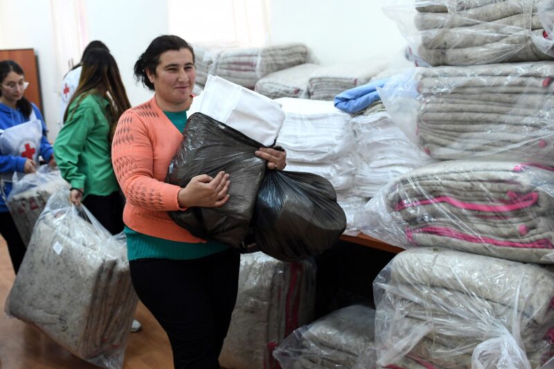 Ethnic Armenian refugees from Nagorno-Karabakh receive humanitarian aid in the town of Vayk on Oct. 2, 2023, ahead of their evacuation to various Armenian cities.